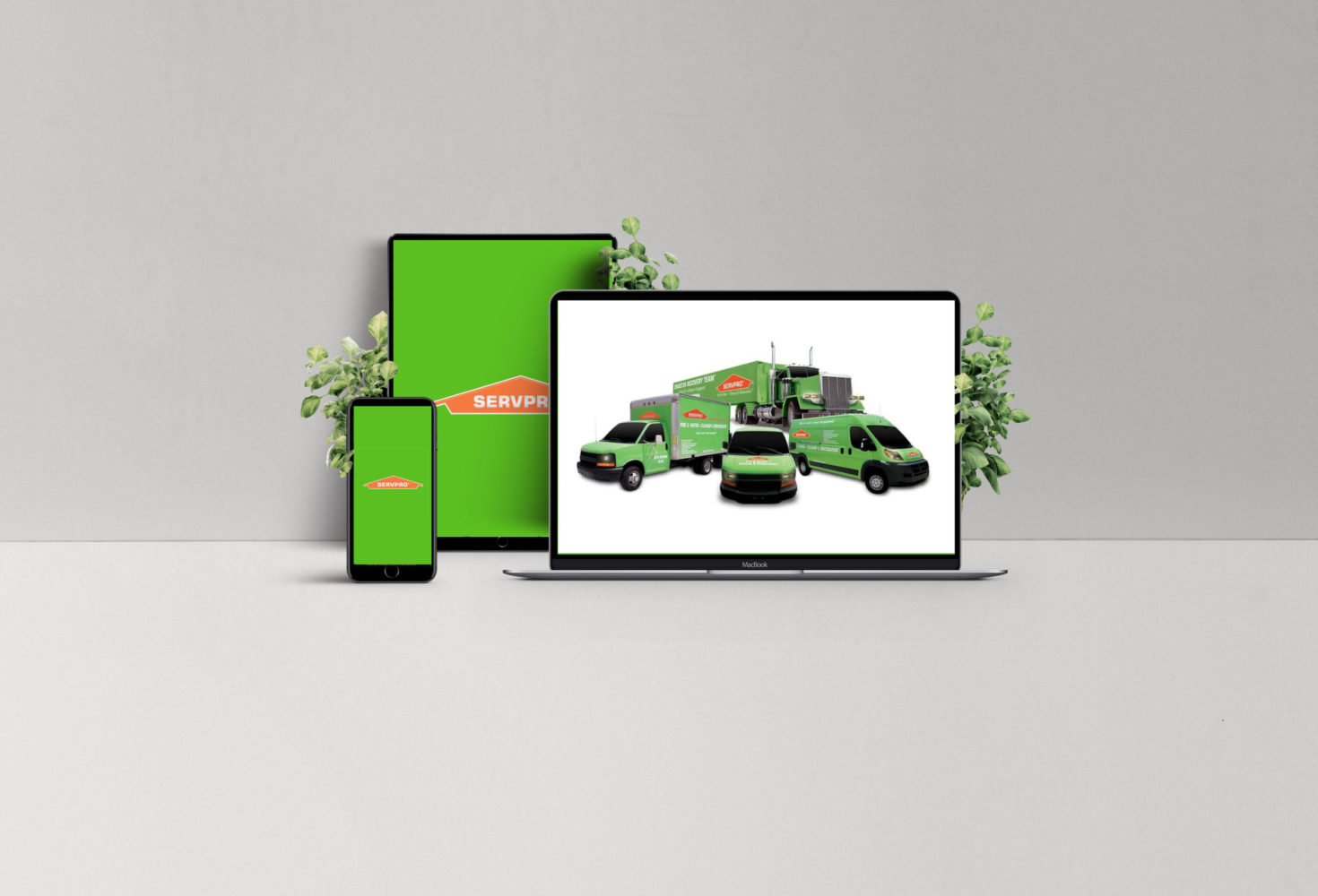 SERVPRO branding on digital devices showcasing service vehicles, emphasizing digital marketing strategy and local targeting for franchise growth.