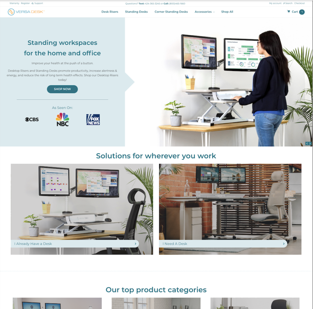 Standing workspace setup featuring a woman using a height-adjustable desk with dual monitors, promoting ergonomic solutions for home and office environments by VersaDesk.
